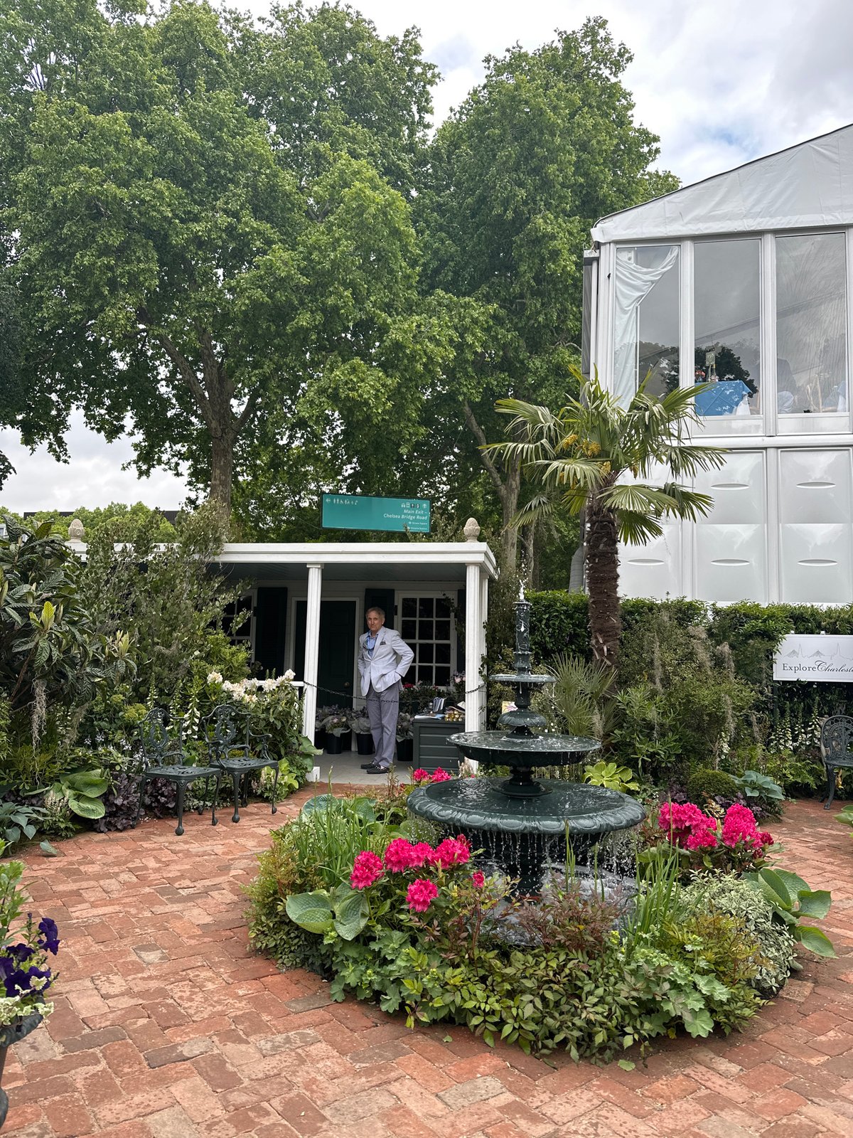London garden scene with fountain, gazebo captured by witness