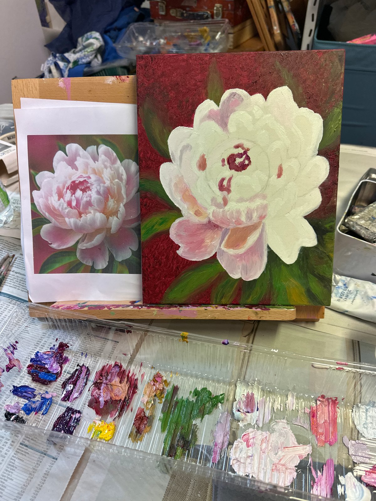 Artist paints peonies, Milan street life documented Monday morning