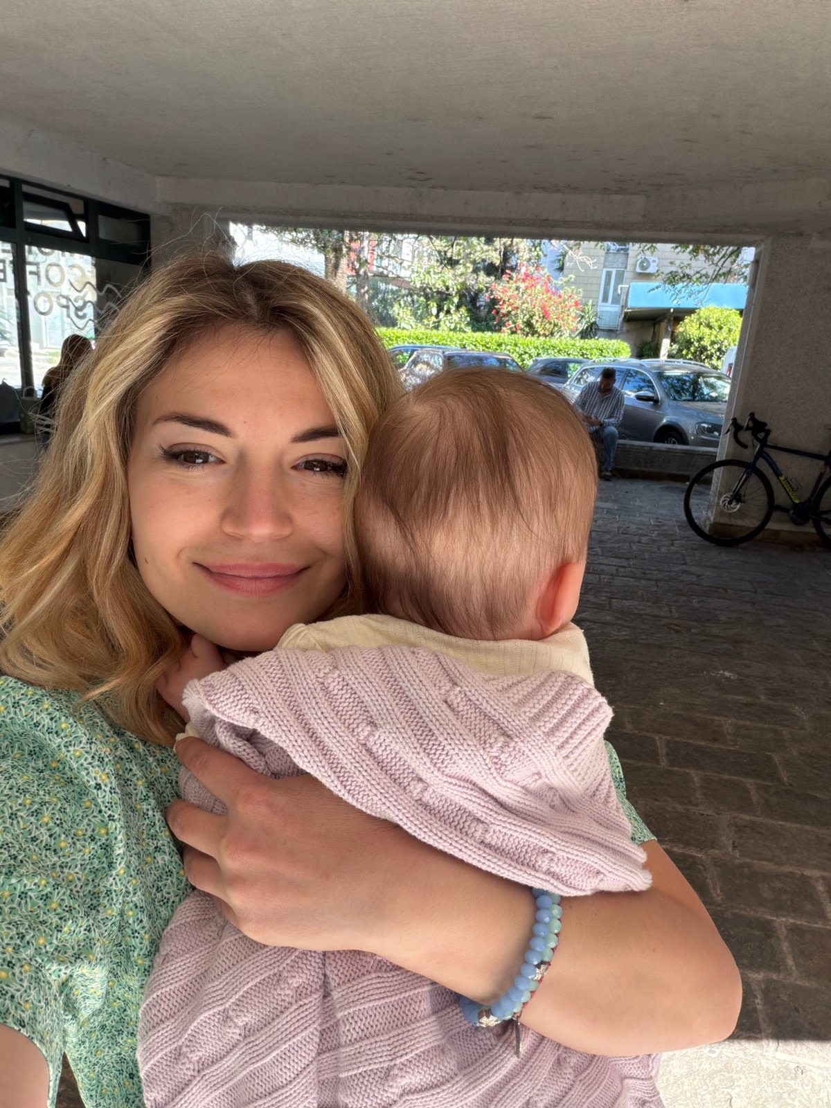 Woman with baby photographed at multiple Budva locations