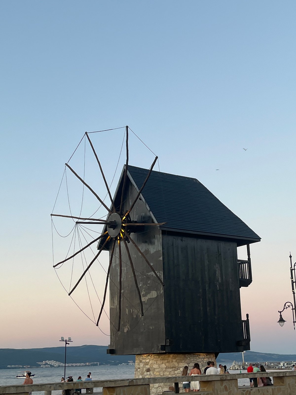 Nesebar old town at golden hour — harbor, windmill, stone streets