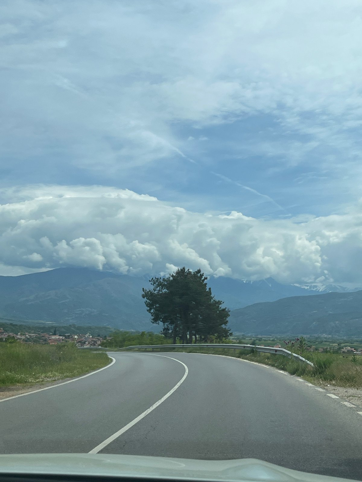 Vehicle travels winding road through Kocherinovo, Bulgaria