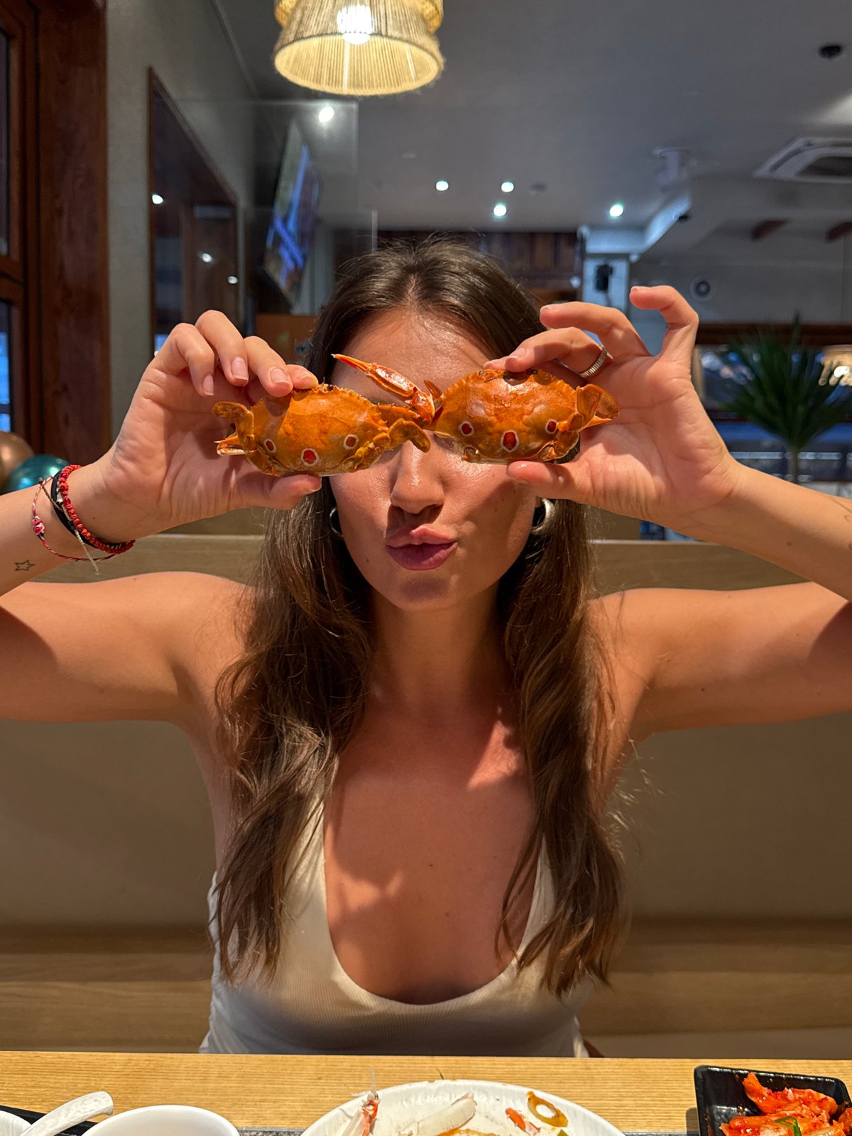 Woman enjoys crab dinner at Da Nang restaurant