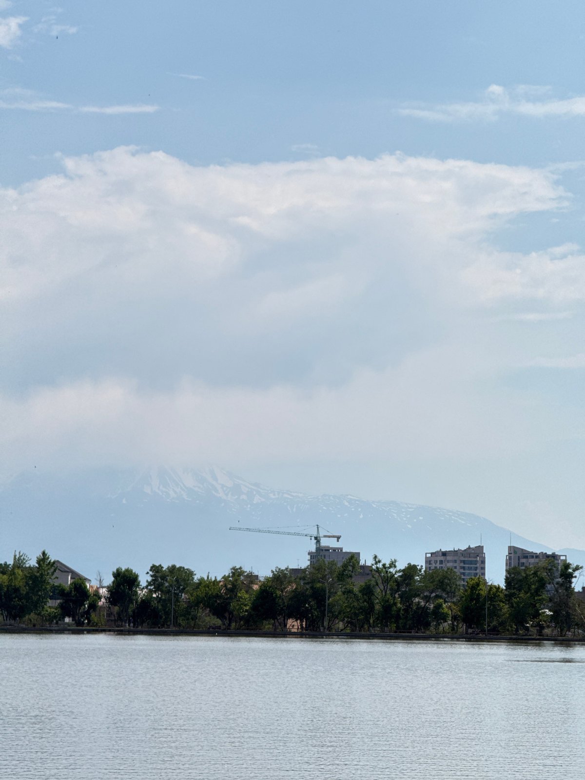Calm lakeside scene in Yerevan with active water aeration