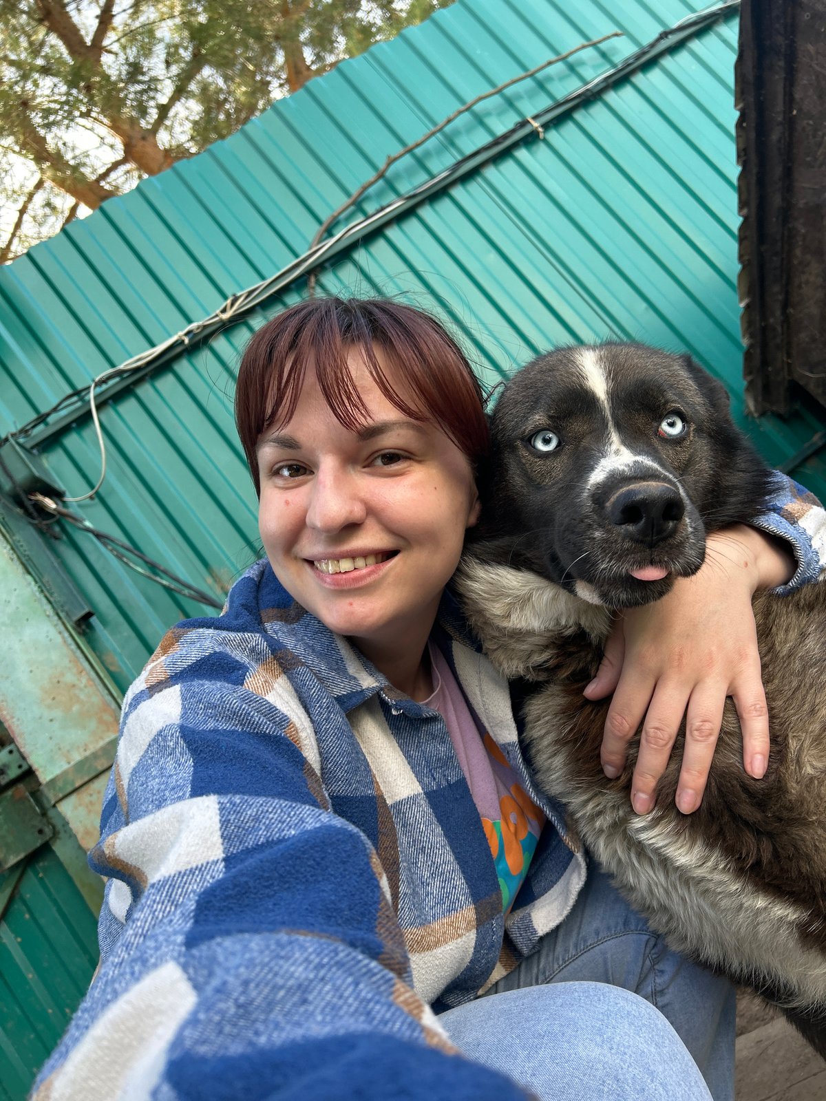 Person and dog enjoy afternoon photo session in Фоки, Russia
