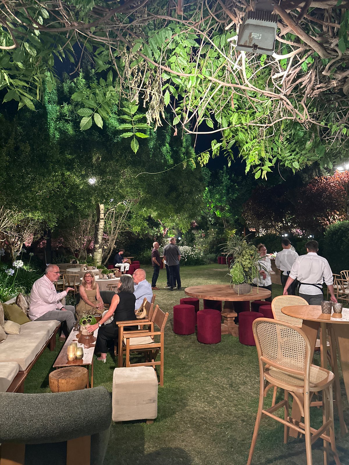 Evening social gathering under full moon in Kfar Shmaryahu