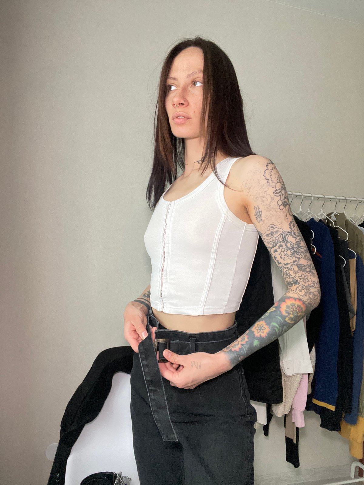 Tattooed woman observed in indoor setting in Izhevsk