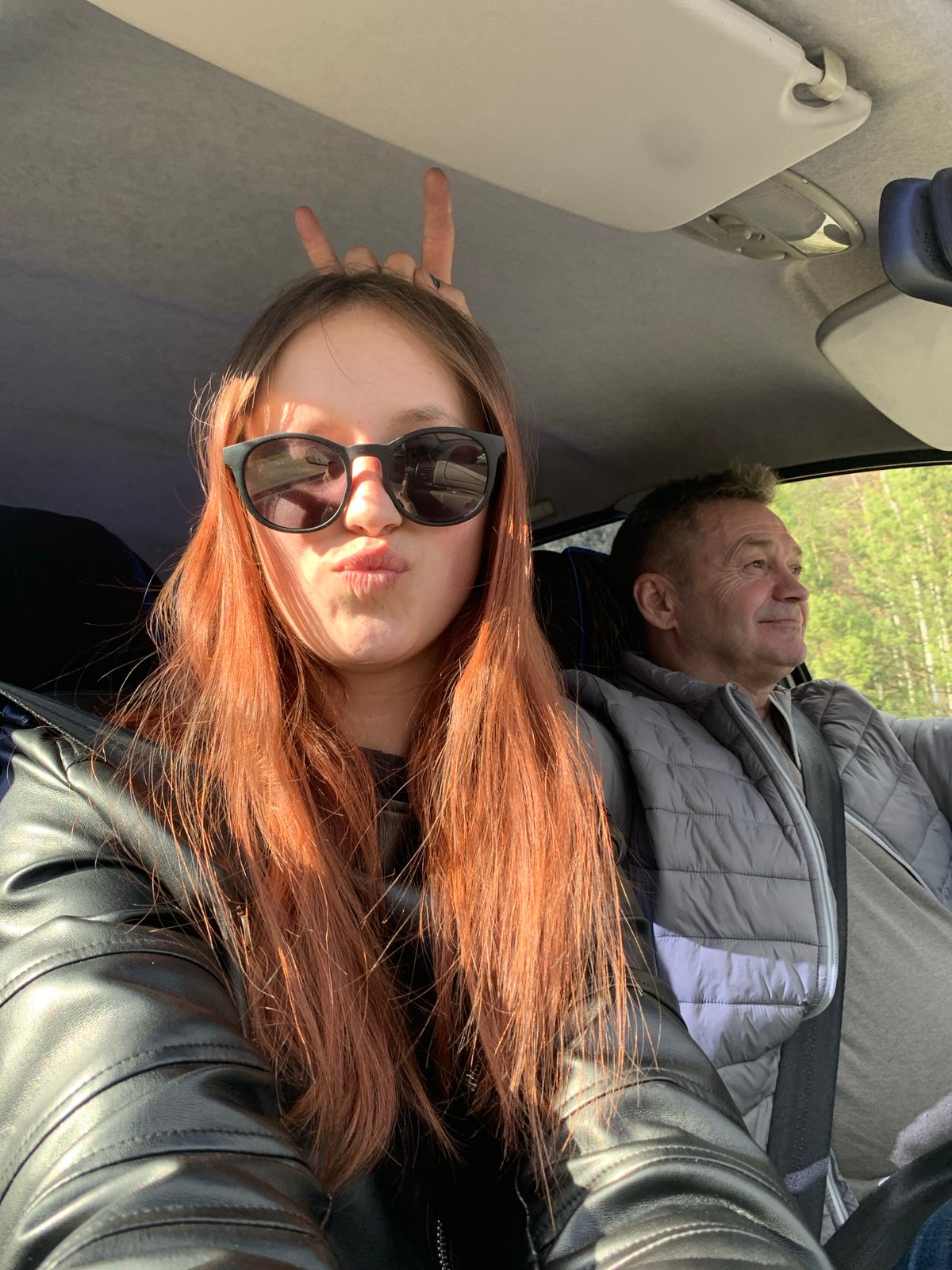 Young people take selfies in vehicle, Chaikovsky Russia