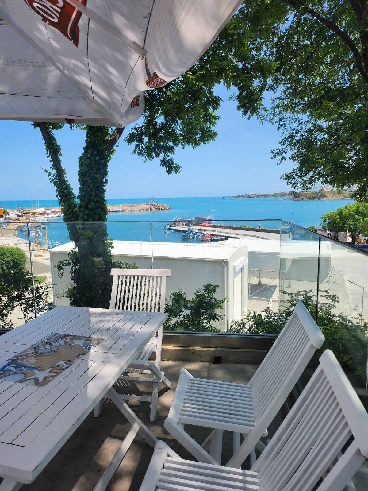 Summer morning scenes captured at Tsarevo harbor restaurants