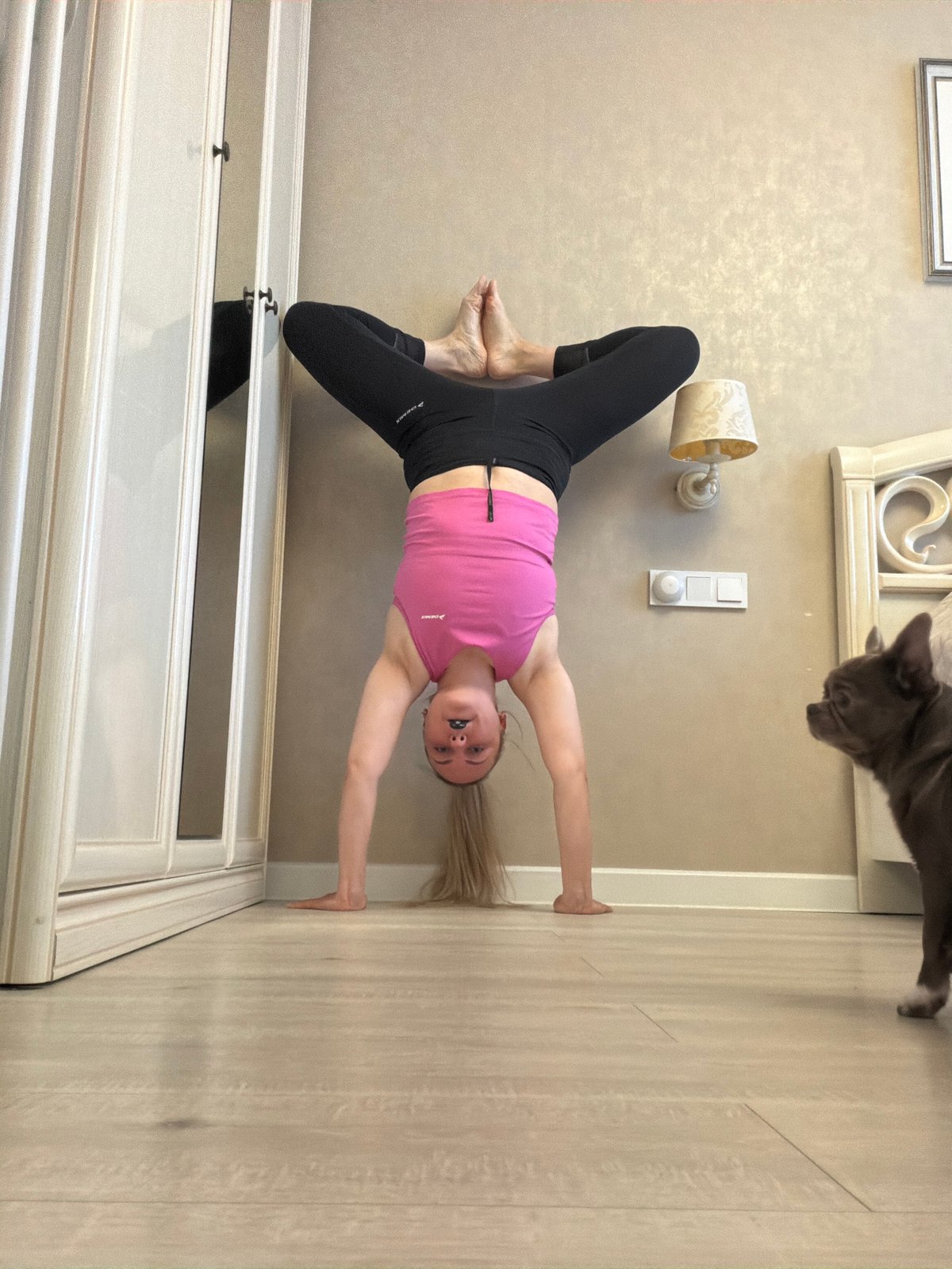 Woman practices yoga with cat in Votkinsk home