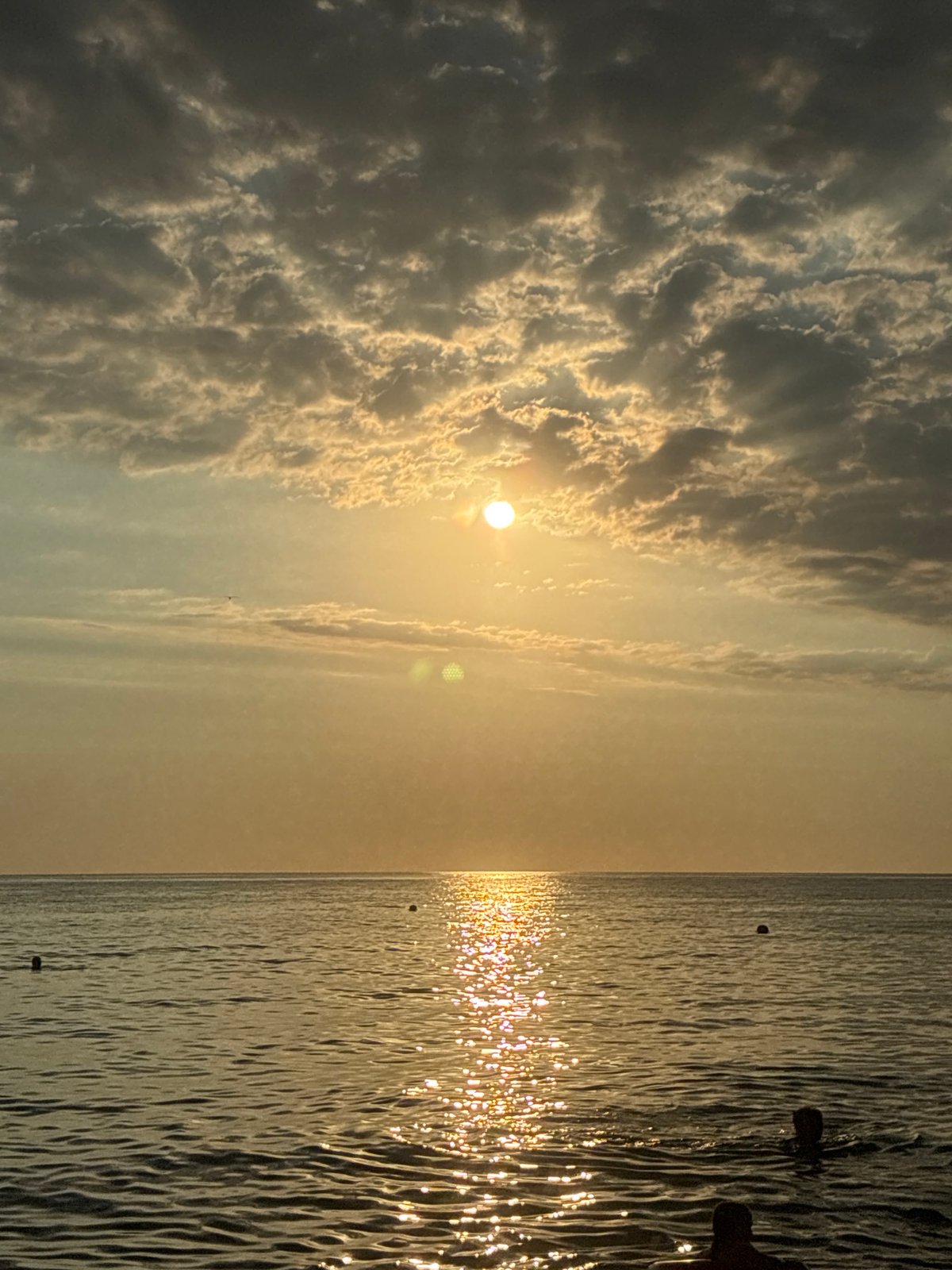 Golden hour on a busy Black Sea beach in Sochi