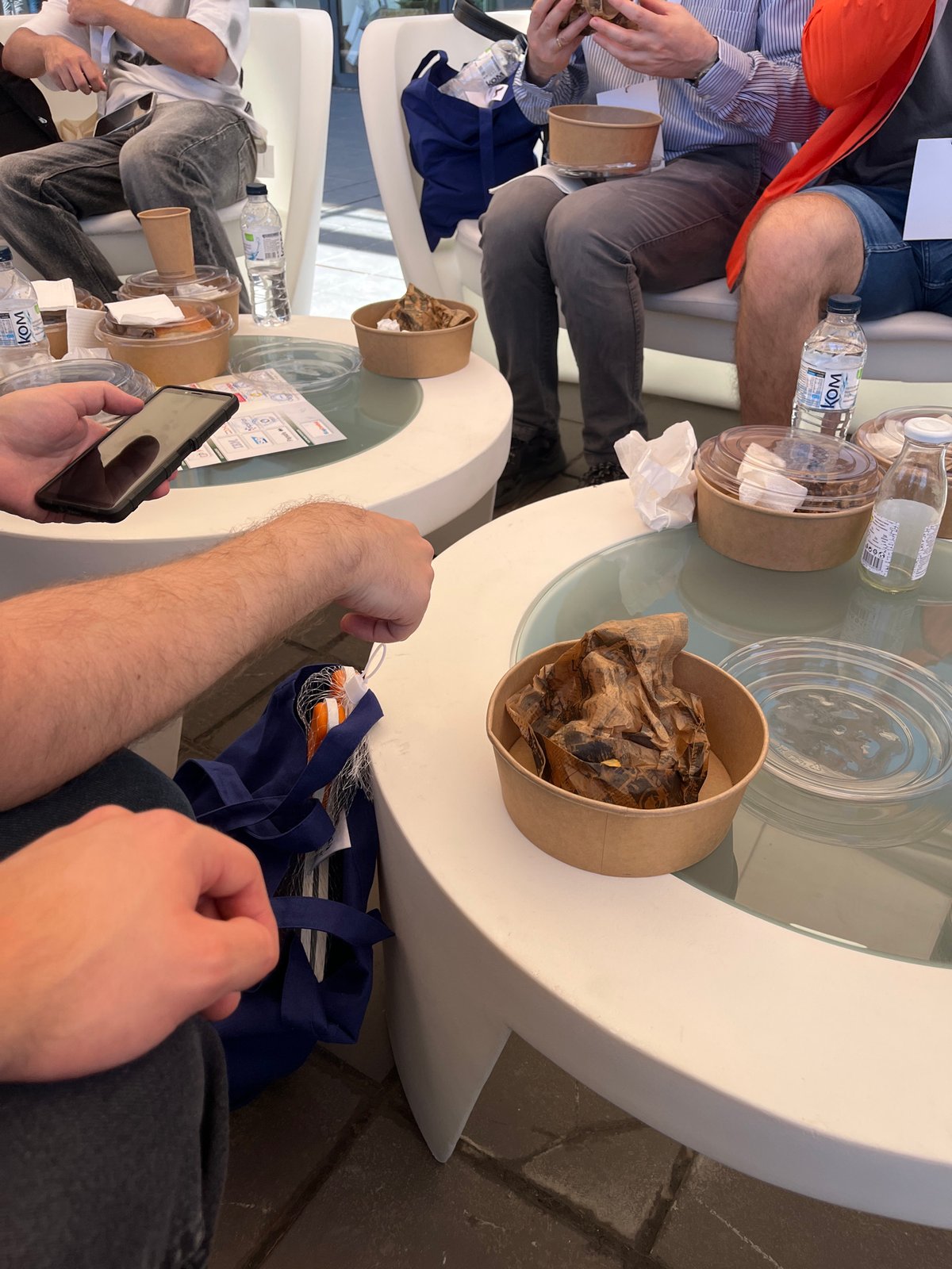 Casual gathering around modern table captured from above