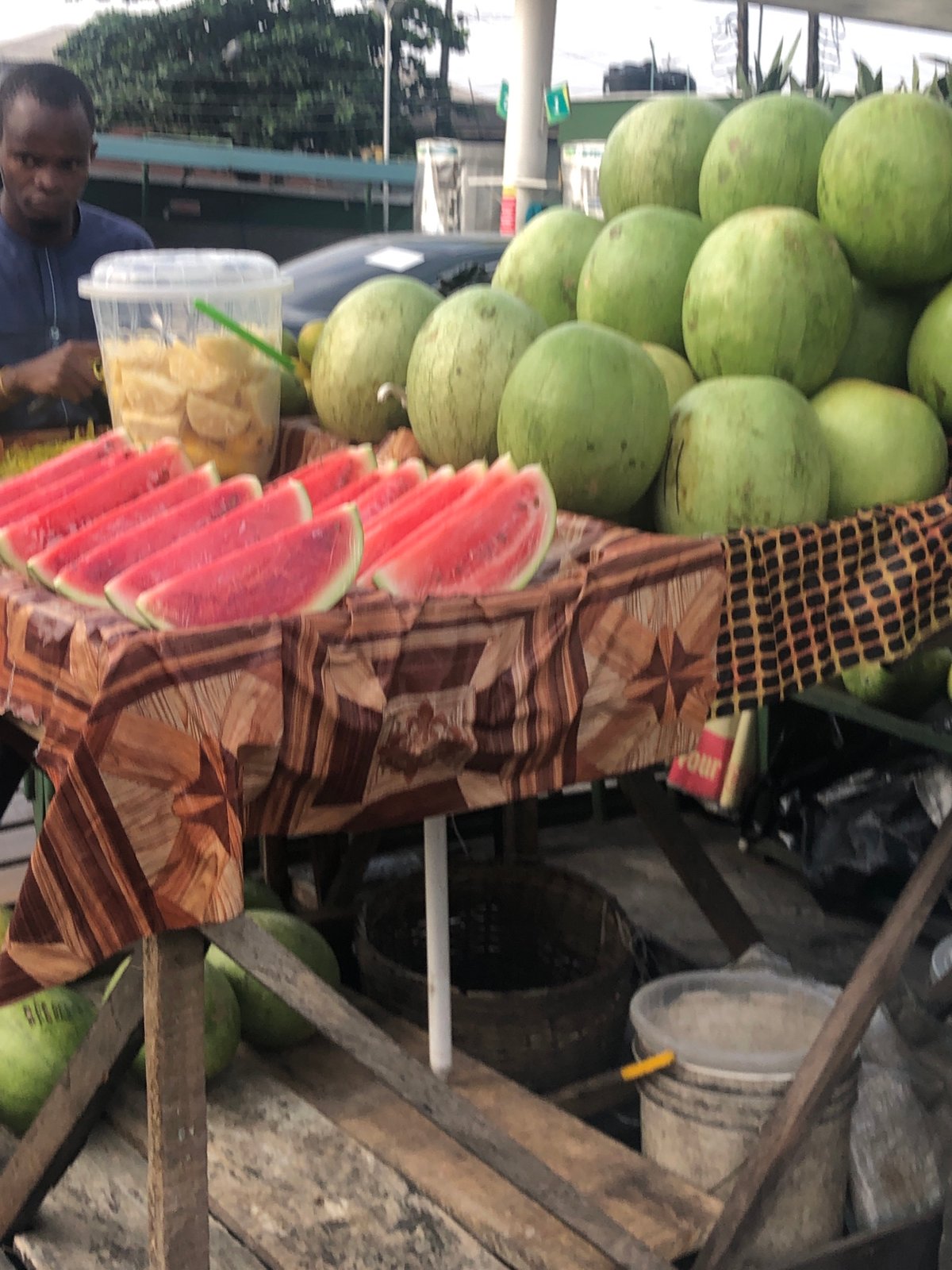 Street market life in Lagos, seen from auto-rickshaws