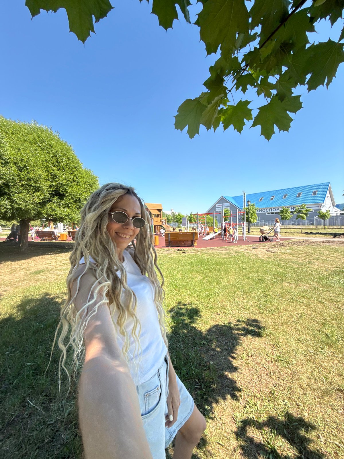 Woman and child enjoy morning at amusement park