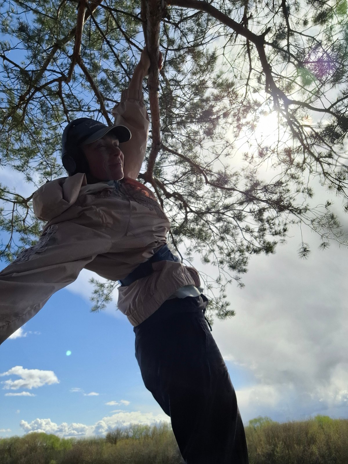 Person explores rural Elets-Malanino outdoors, swinging from trees