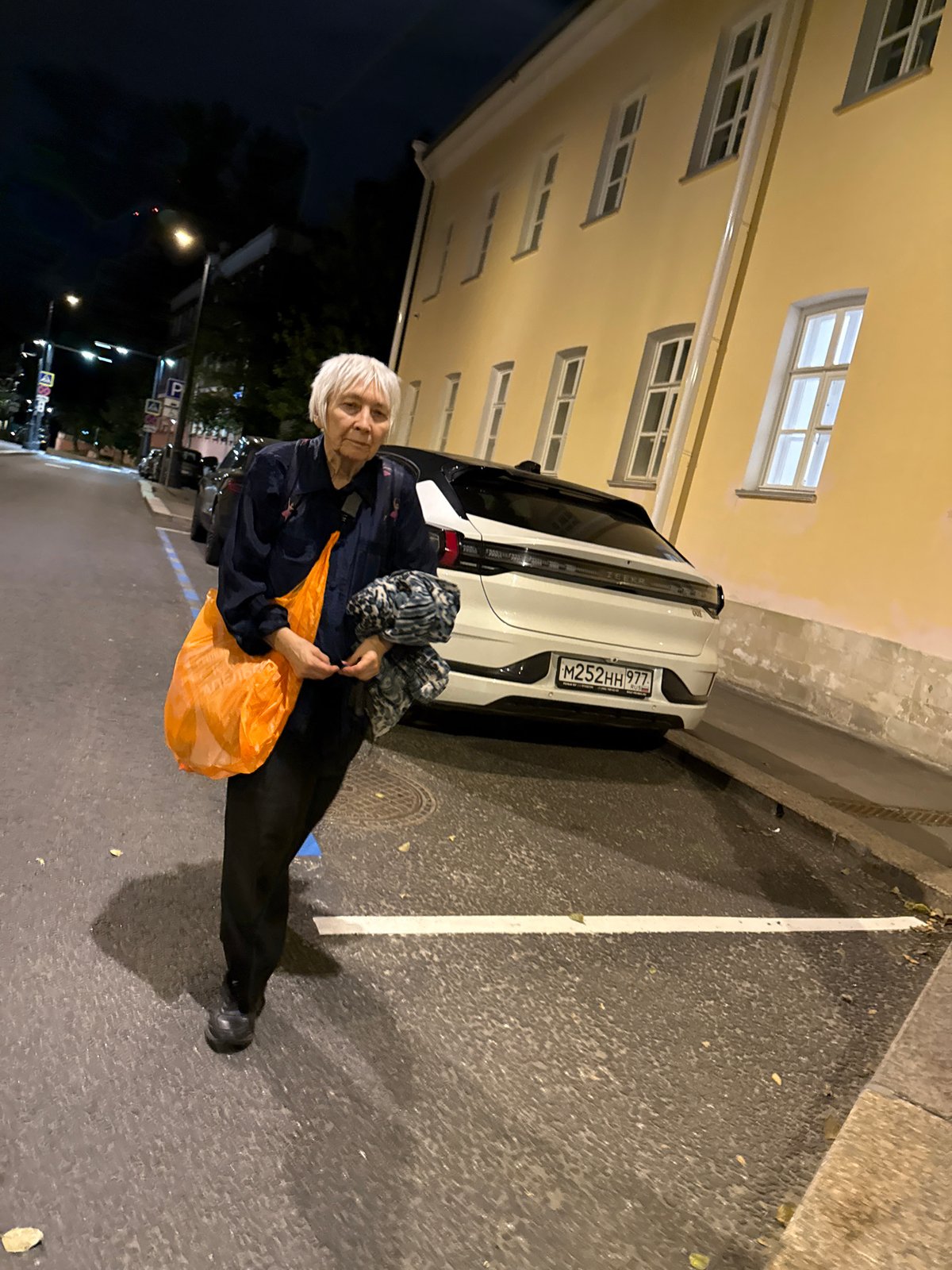 Nighttime street life in a Moscow residential neighborhood