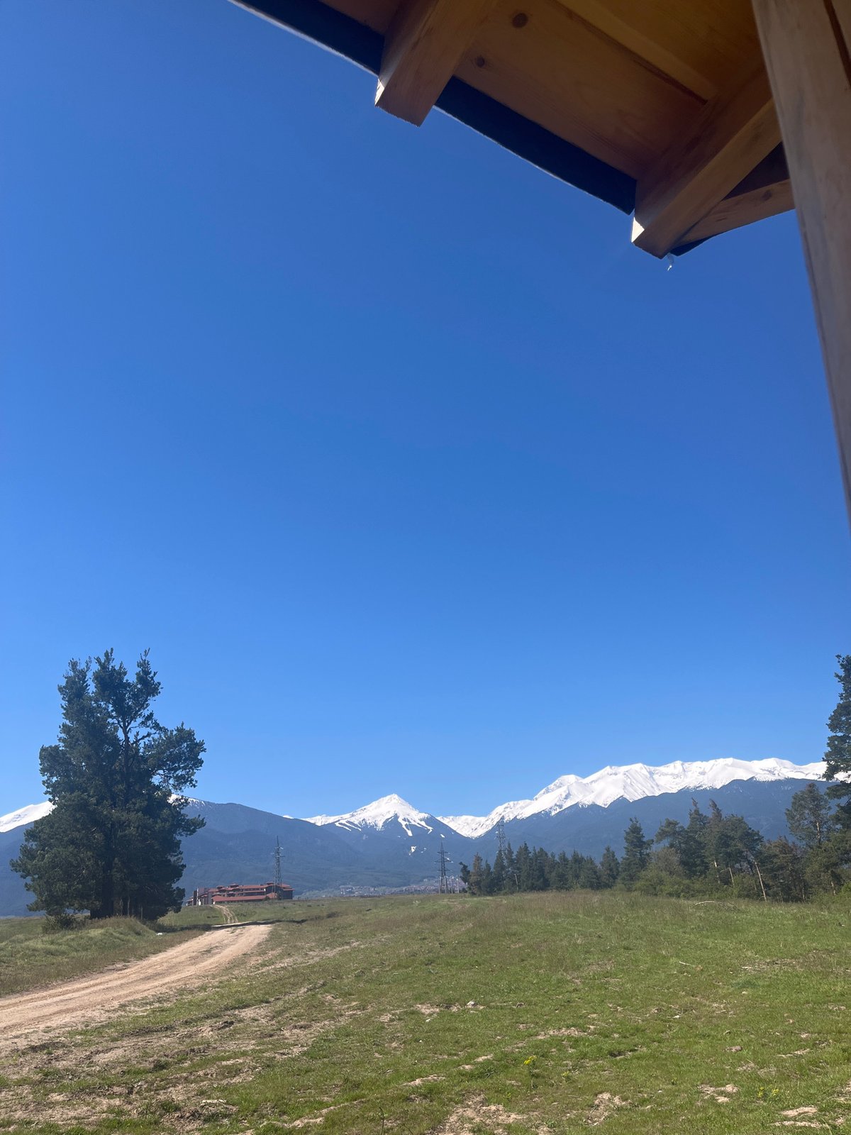 Morning mountain views documented from elevated grassy terrain