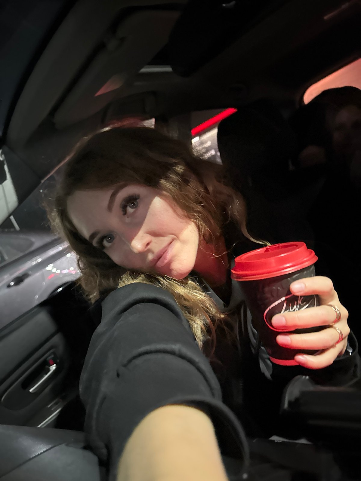 Woman with coffee tumbler observed in car in Krilovo