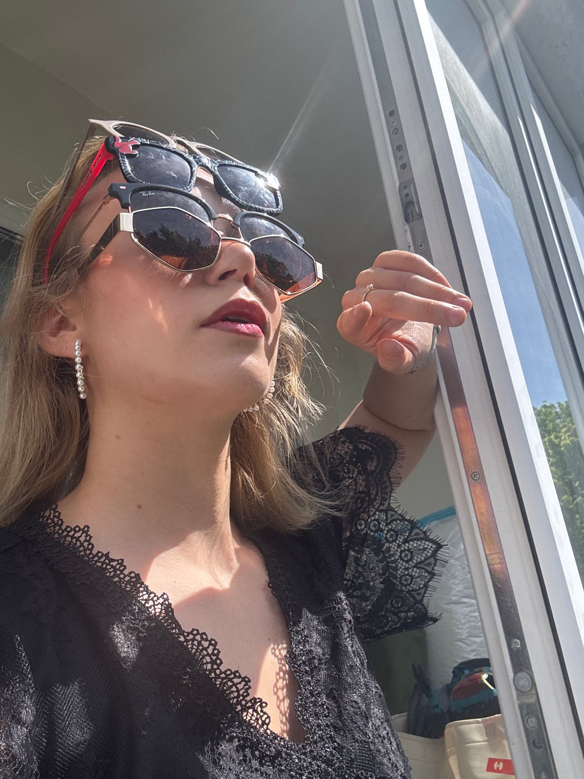 Woman models Spider-Man sunglasses during indoor photo session in Riga