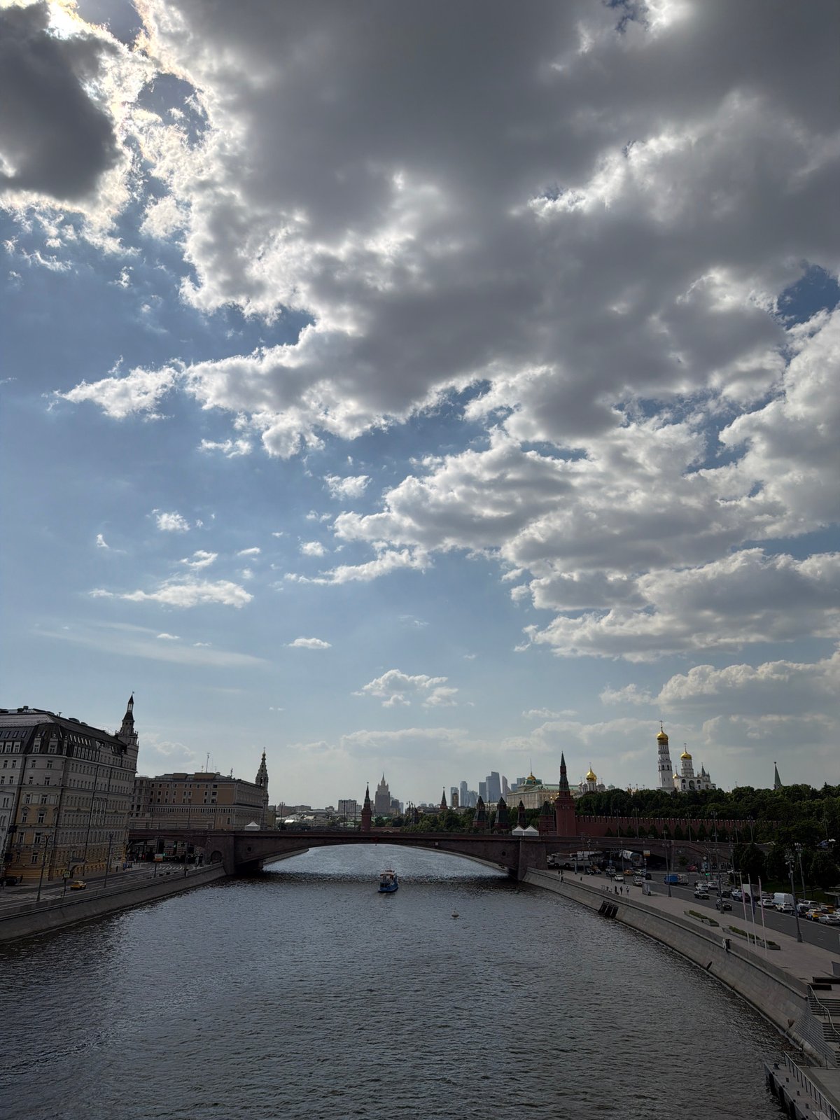 Moscow riverfront scene captured showing Kremlin and boat traffic