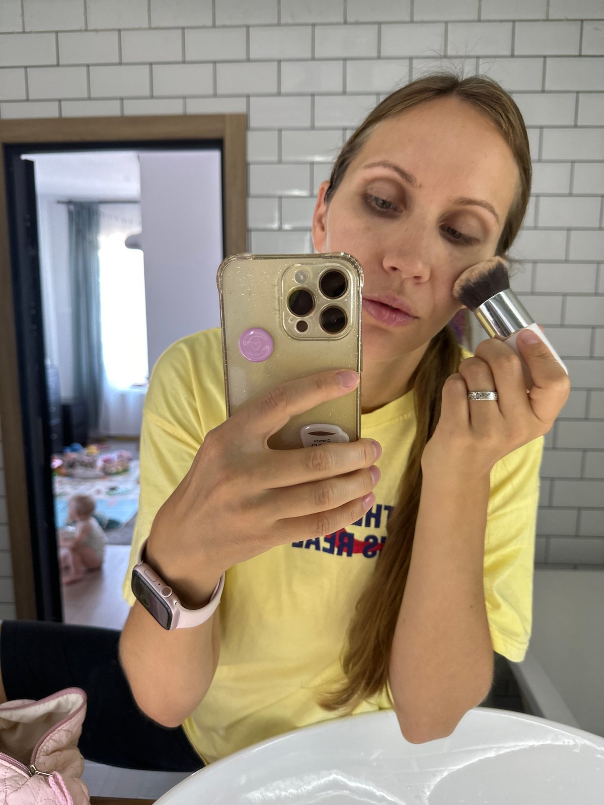 Morning makeup routine in a Vsevolozhsk bathroom