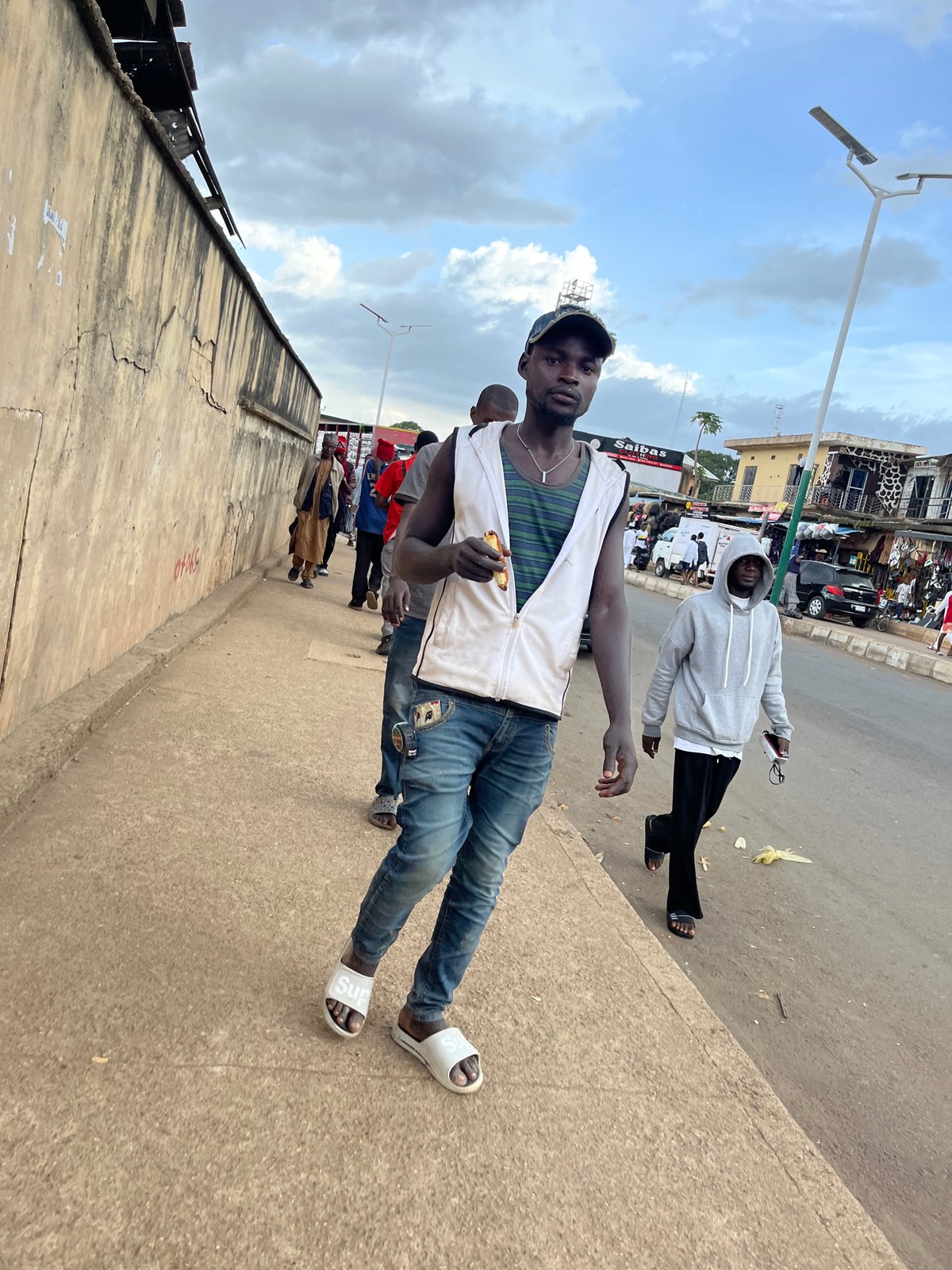 Foot traffic and street life on a Jos, Nigeria afternoon