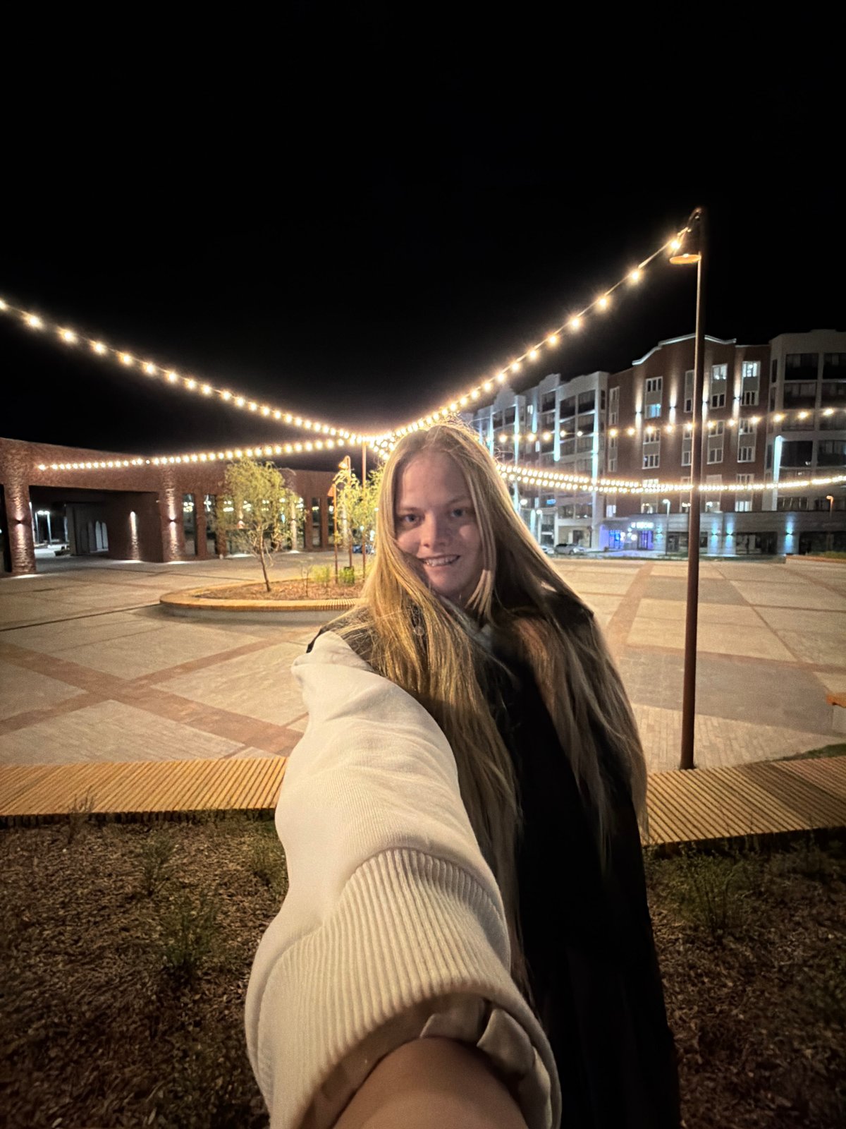 Woman poses for nighttime photos in Izhevsk, Russia