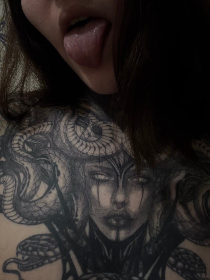 Tattooed woman documents herself in 30 photos in snowy Russia