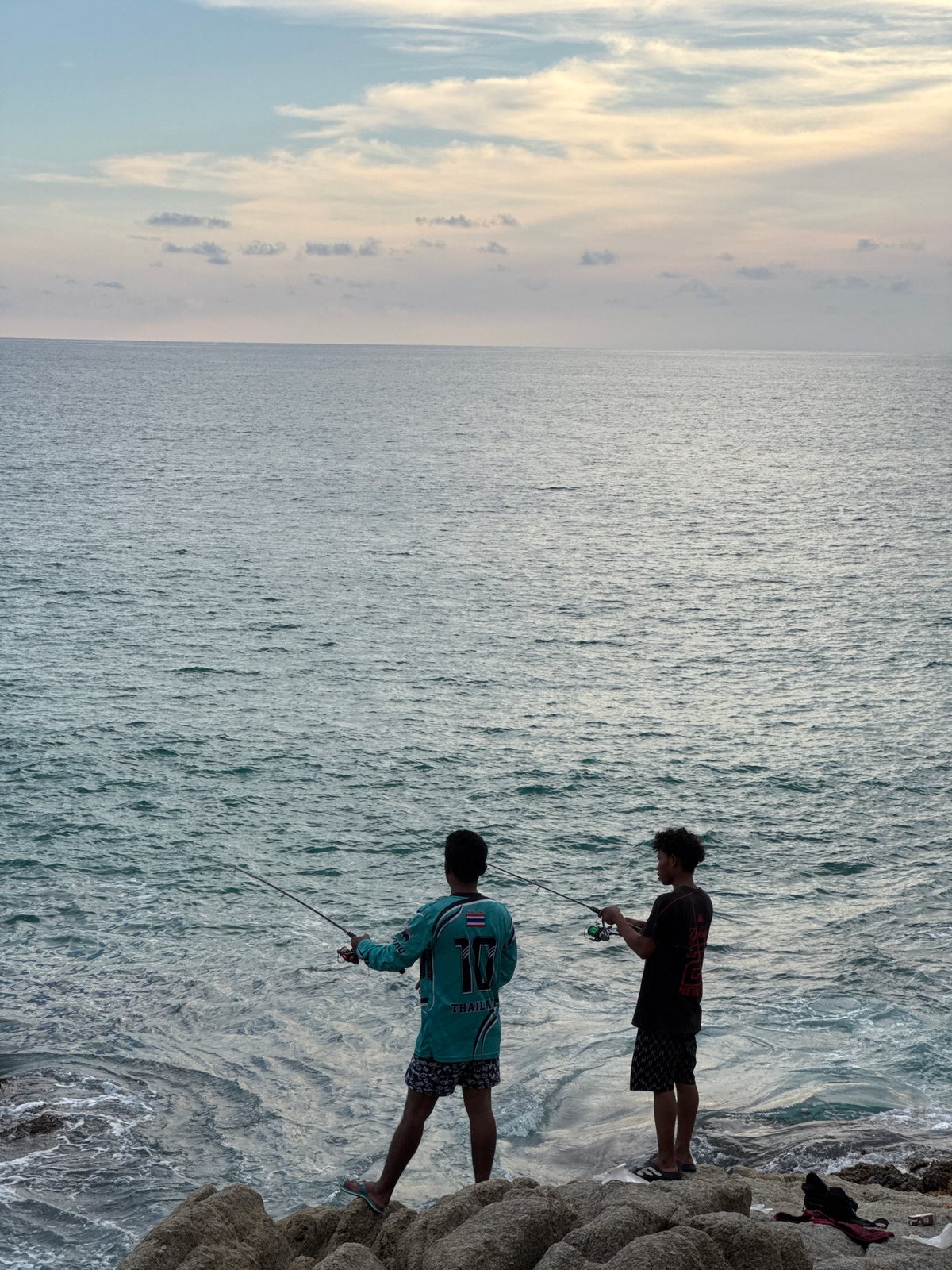 Rocky Choeng Thale coastline at dusk, Andaman sunset