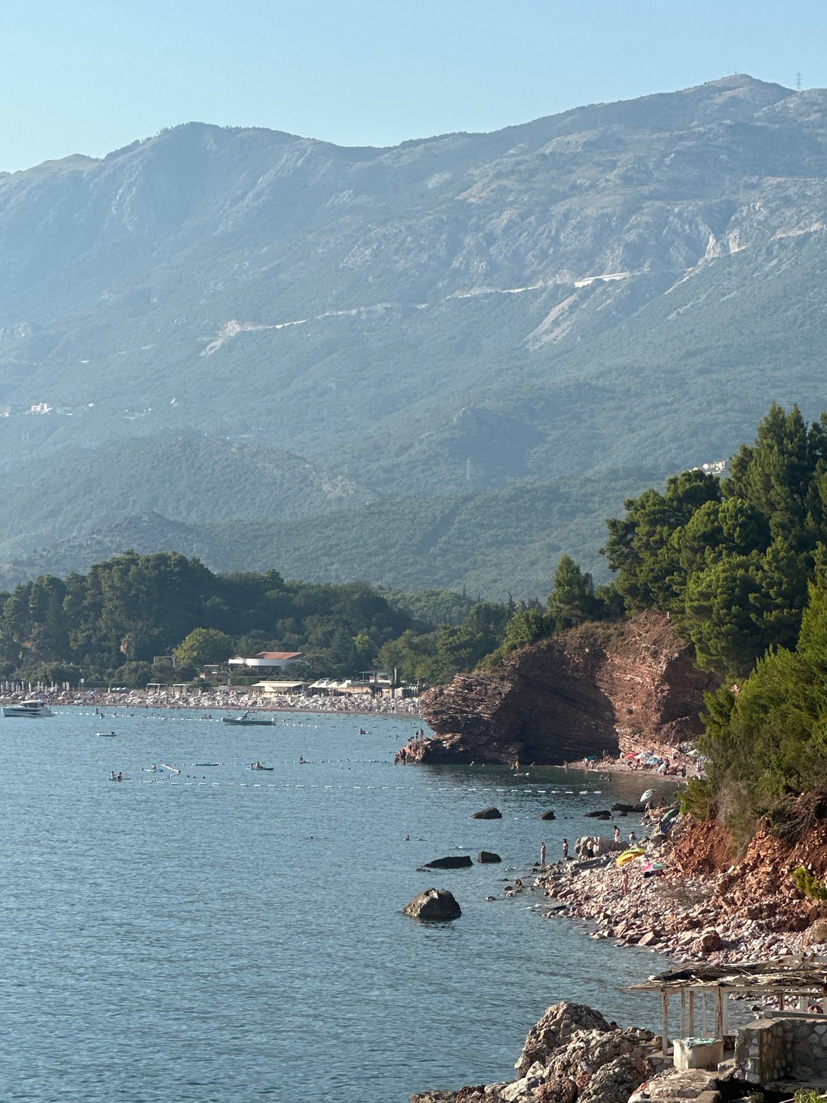 Sveti Stefan's historic island and Adriatic waters on a summer afternoon