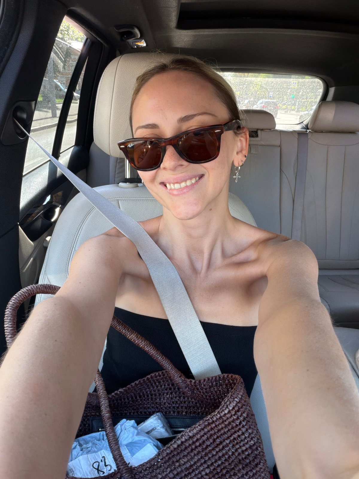 Quick selfies from the passenger seat of a moving Moscow car.