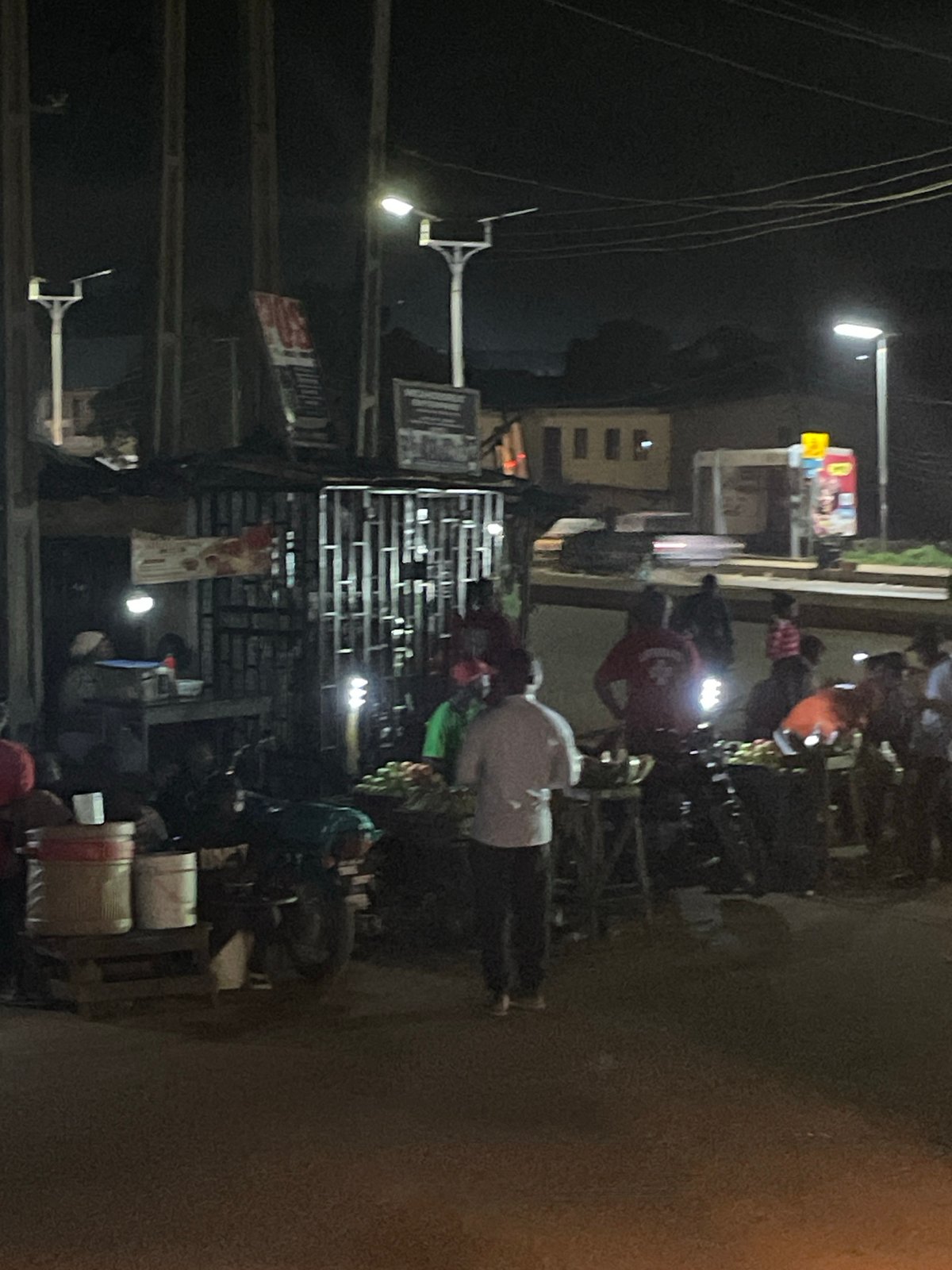 Nighttime street markets and urban commerce documented across unknown locations