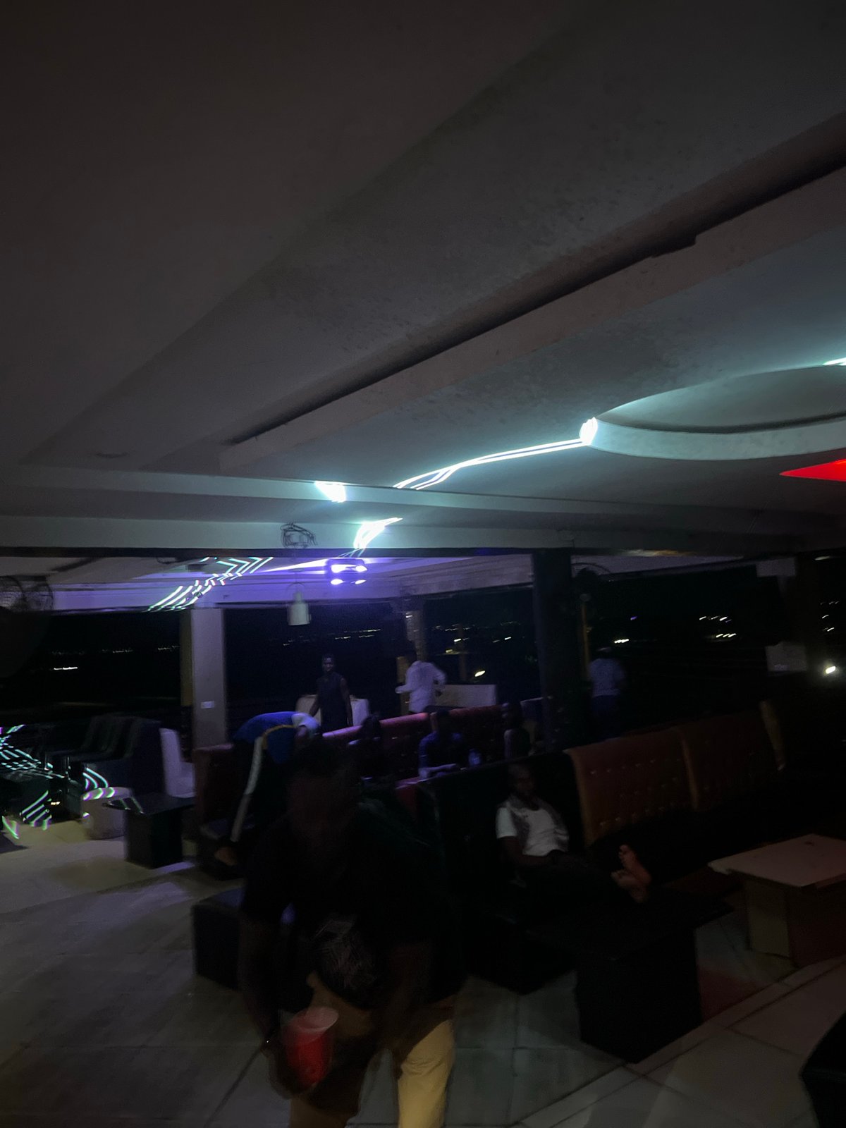 Nigerian nightclub patrons display luxury watches during evening gathering
