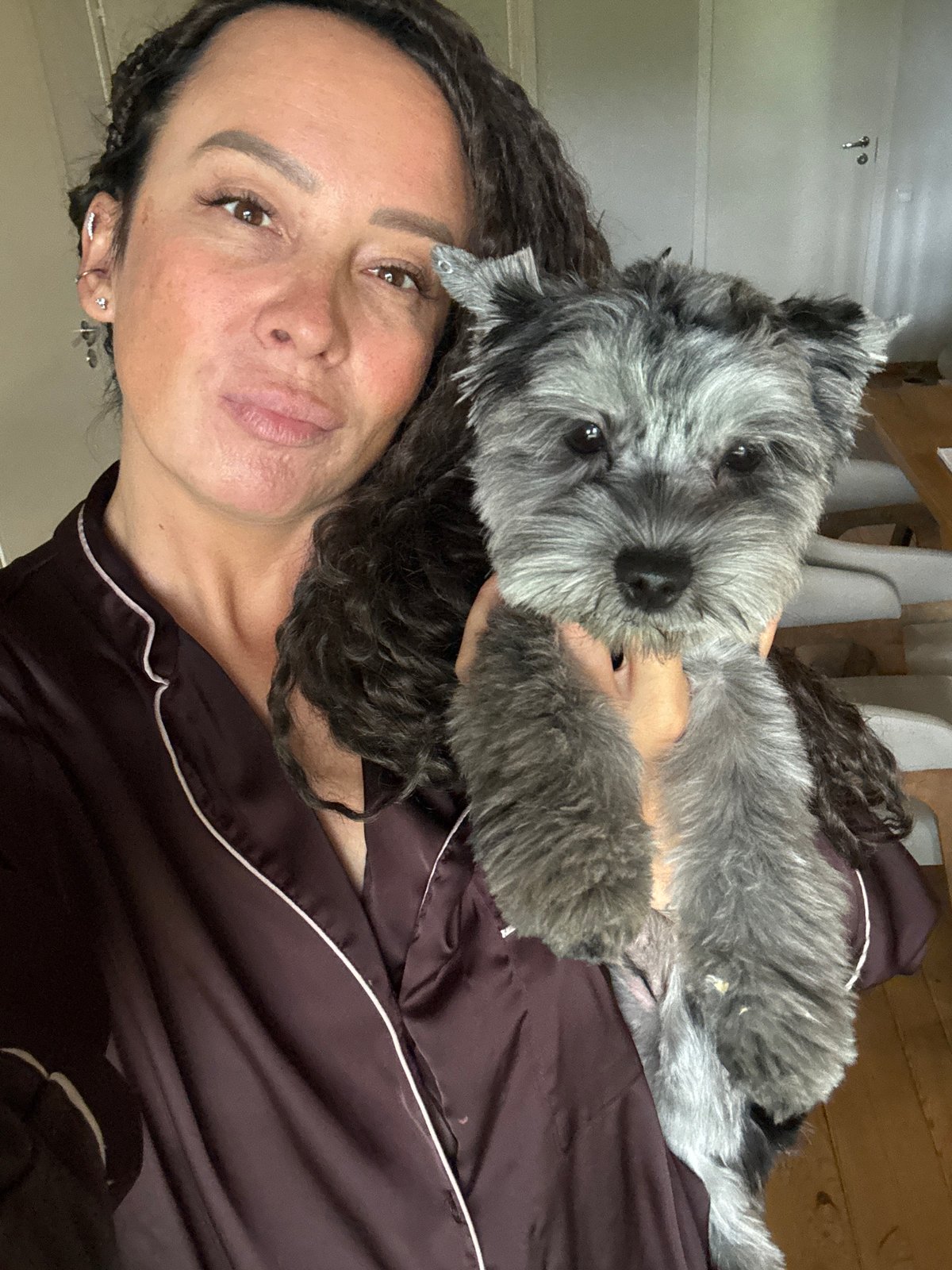 Woman and dog captured in casual morning moments in Chaikovsky
