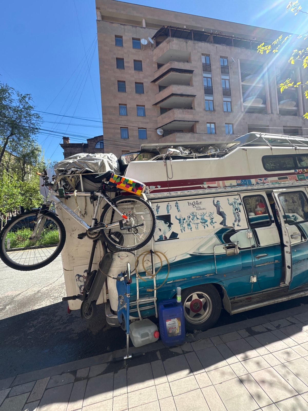 Distinctive Blue Double-Decker Vehicle Spotted on Yerevan Sidewalk