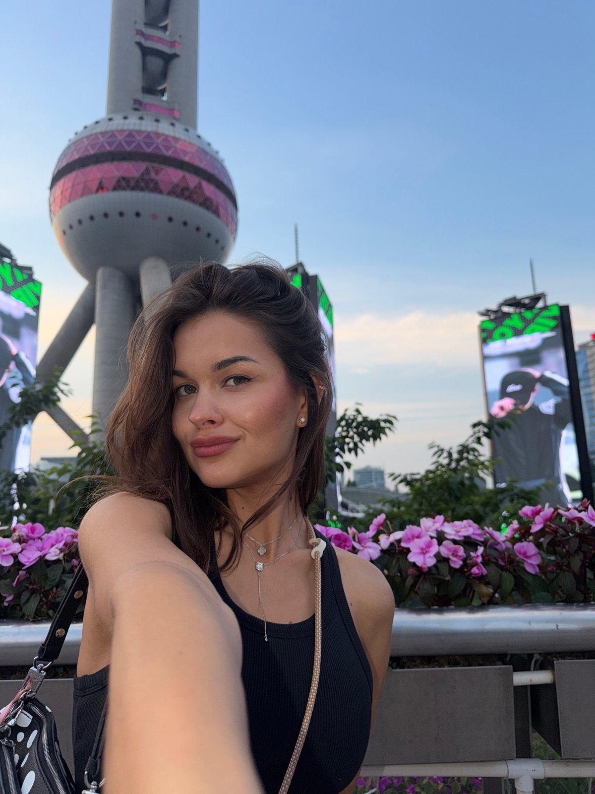 Tourists photograph themselves at Shanghai's Oriental Pearl Tower