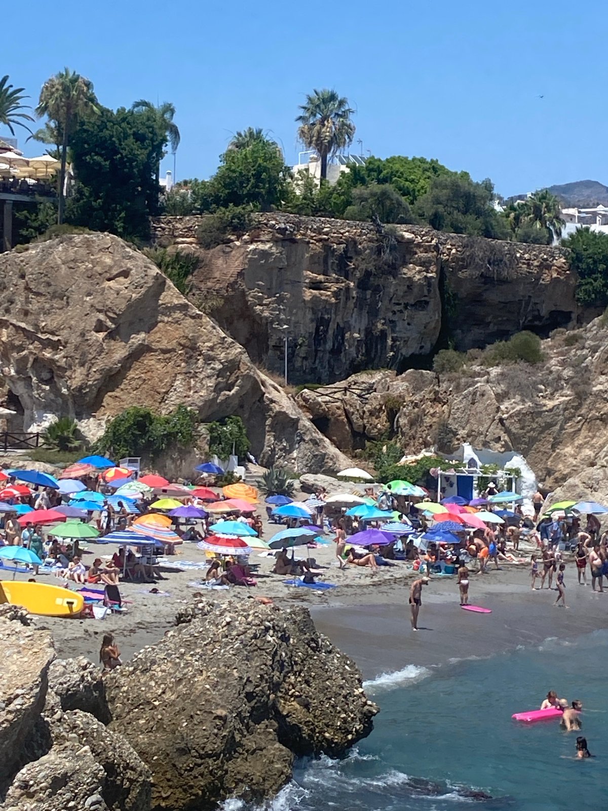 Nerja's beaches and seafront buzzing on a sunny July afternoon