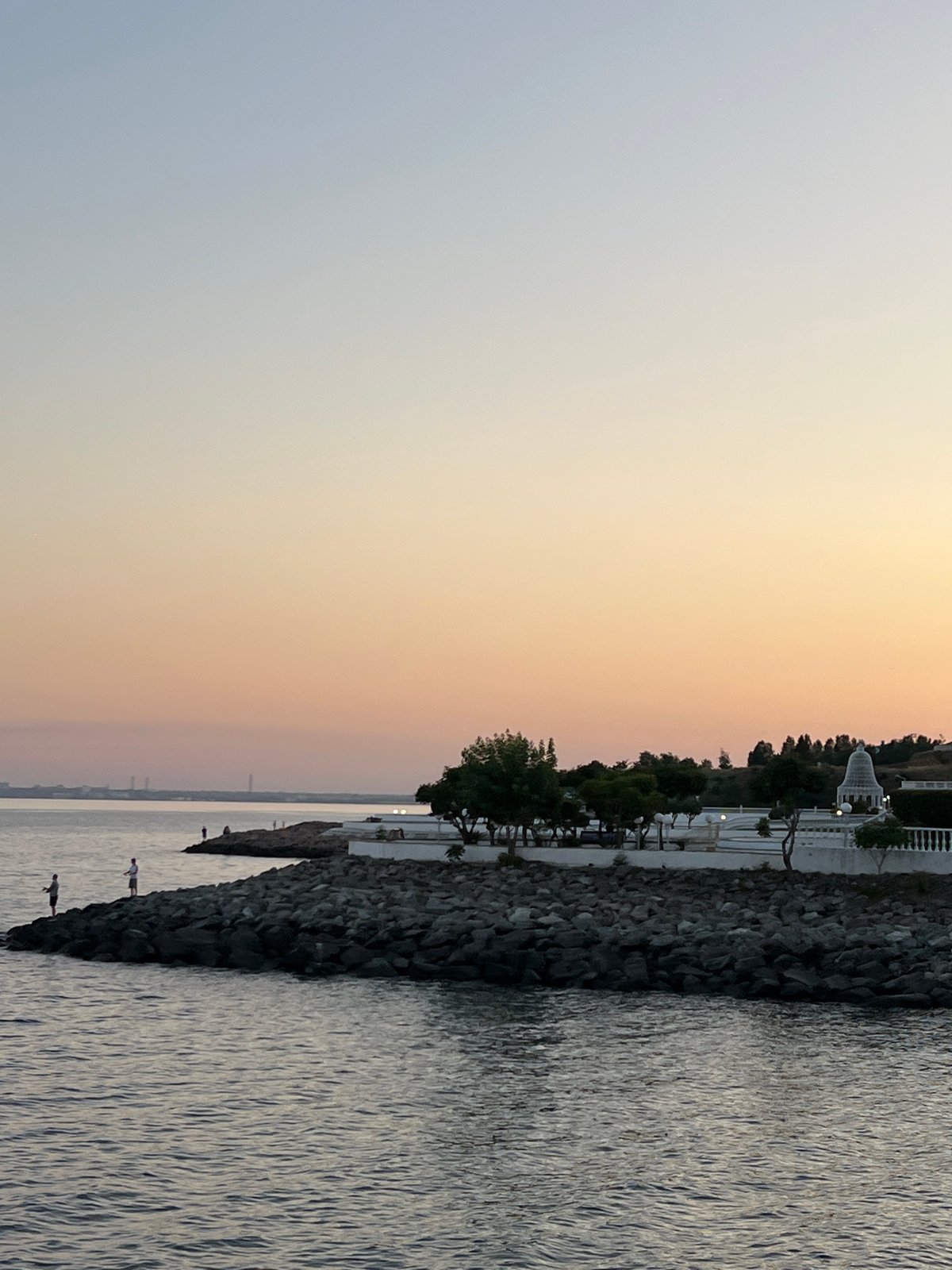 Sunset stroll along a Ukrainian beach resort promenade