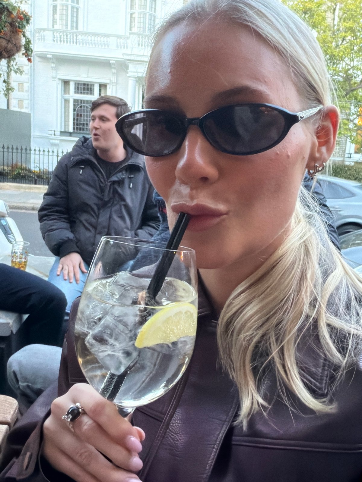 Evening social gathering at London pub features outdoor drinks