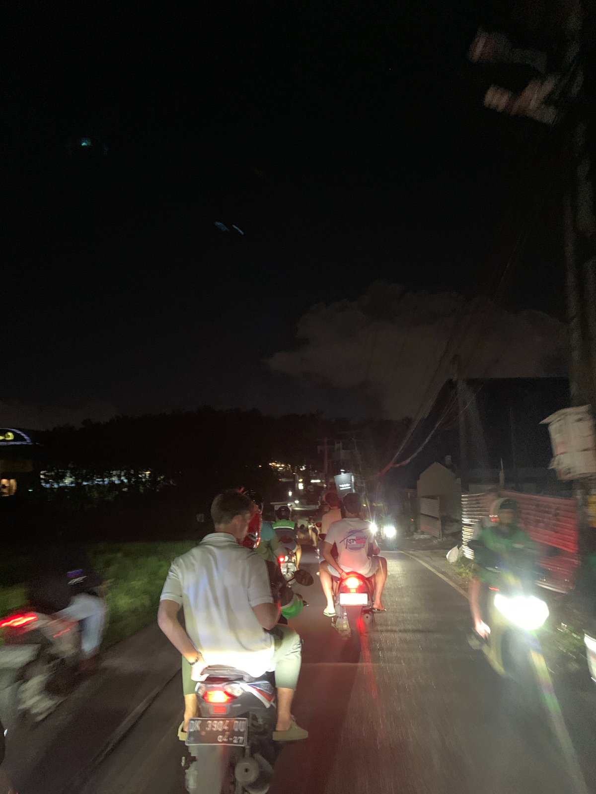 Nighttime motorcycle traffic captured in North Kuta, Indonesia
