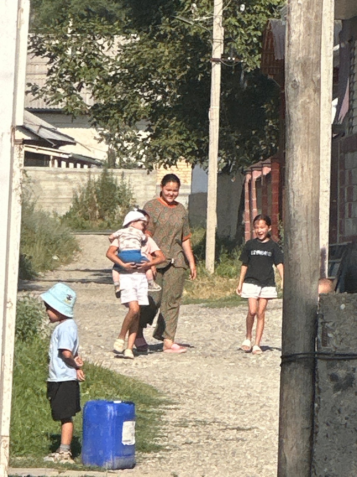 Informal car deal going down at a dusty Kyrgyzstan lot