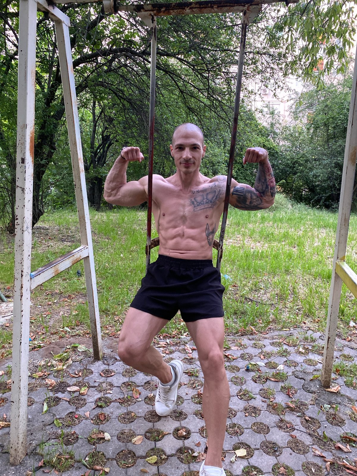 Man performs calisthenics workout on playground equipment in Bulgaria