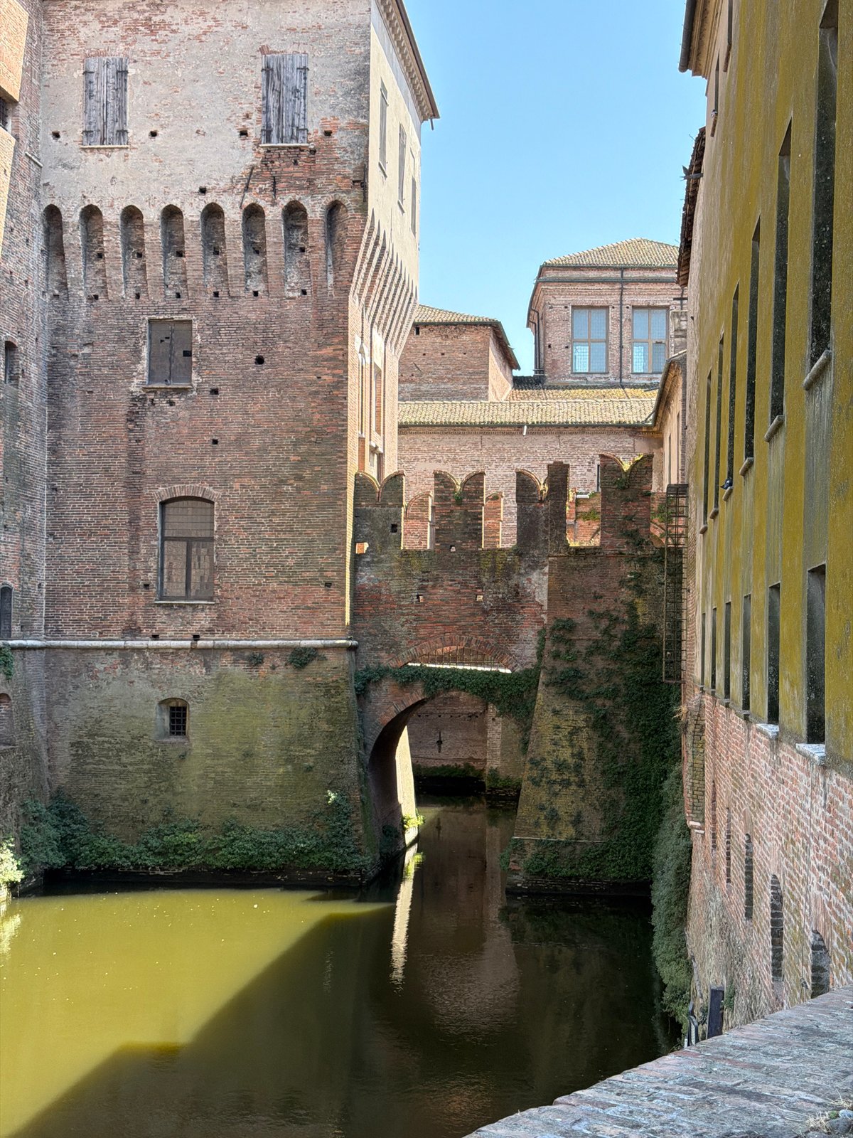 Tourist photographs medieval castle fortress in Mantua, Italy