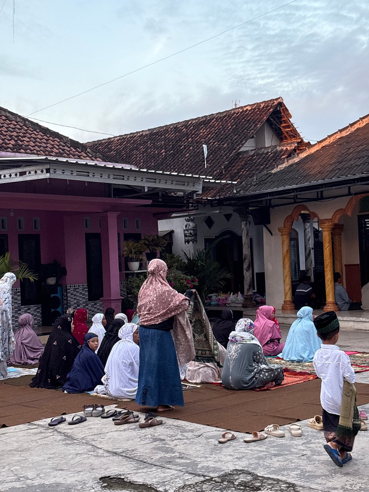 Community gathers for evening prayers in Gadingrejo, Indonesia