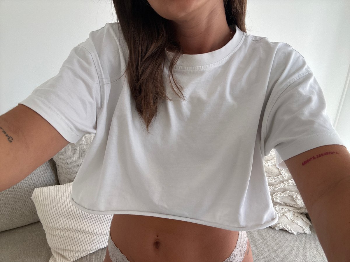 Person in white clothing observed relaxing indoors in Cannes