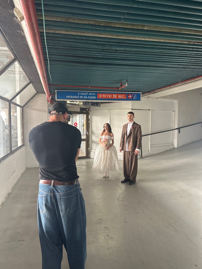 Bride conducts wedding photo session across Tel Aviv venues