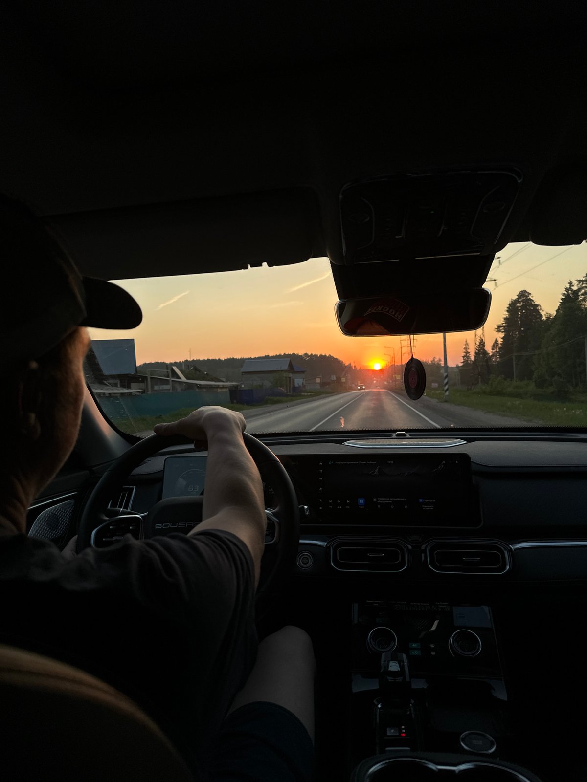 Driver captures sunset view on road near Chaikovsky