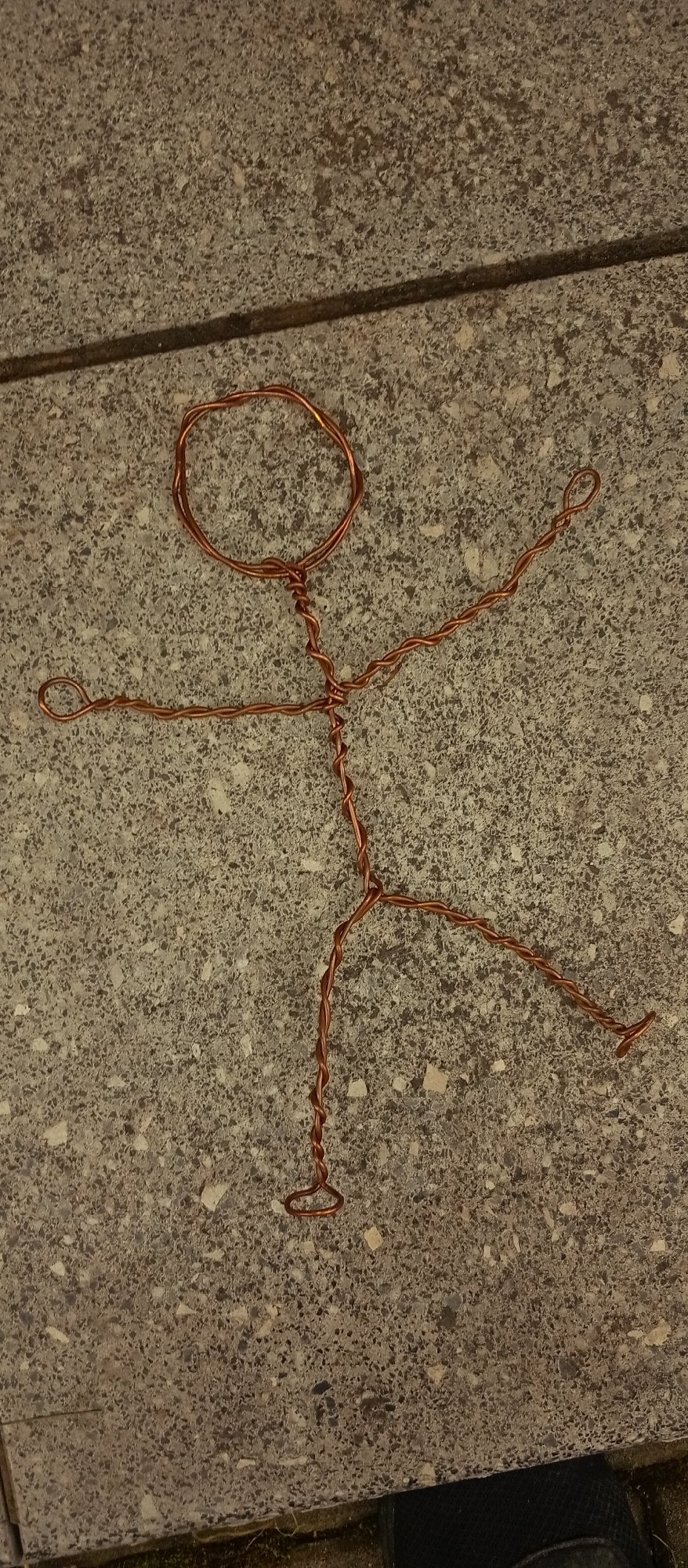 Copper wire stick figure spotted around a Karviná park