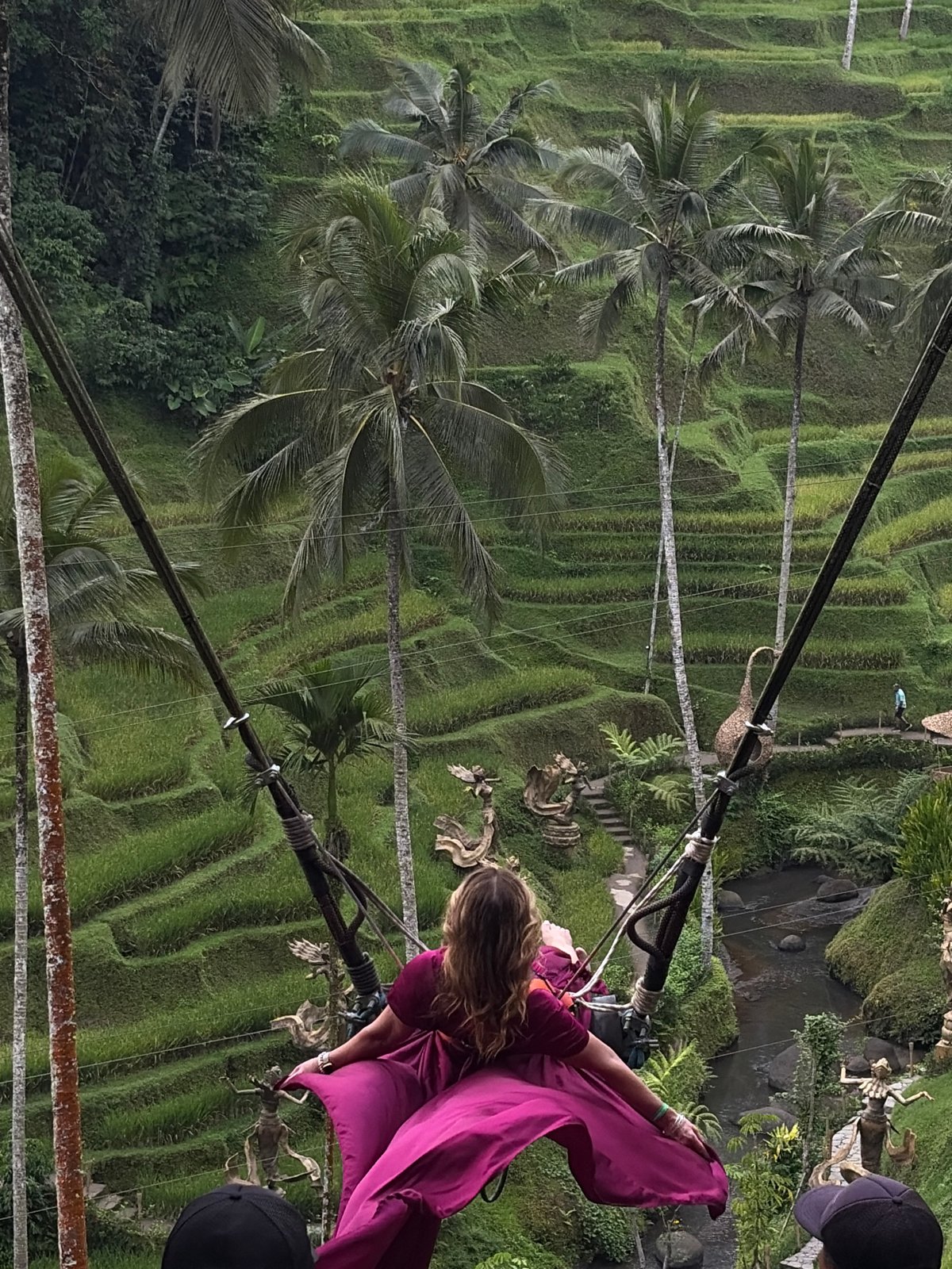 Swinging over Tegallalang's rice terraces in a magenta dress