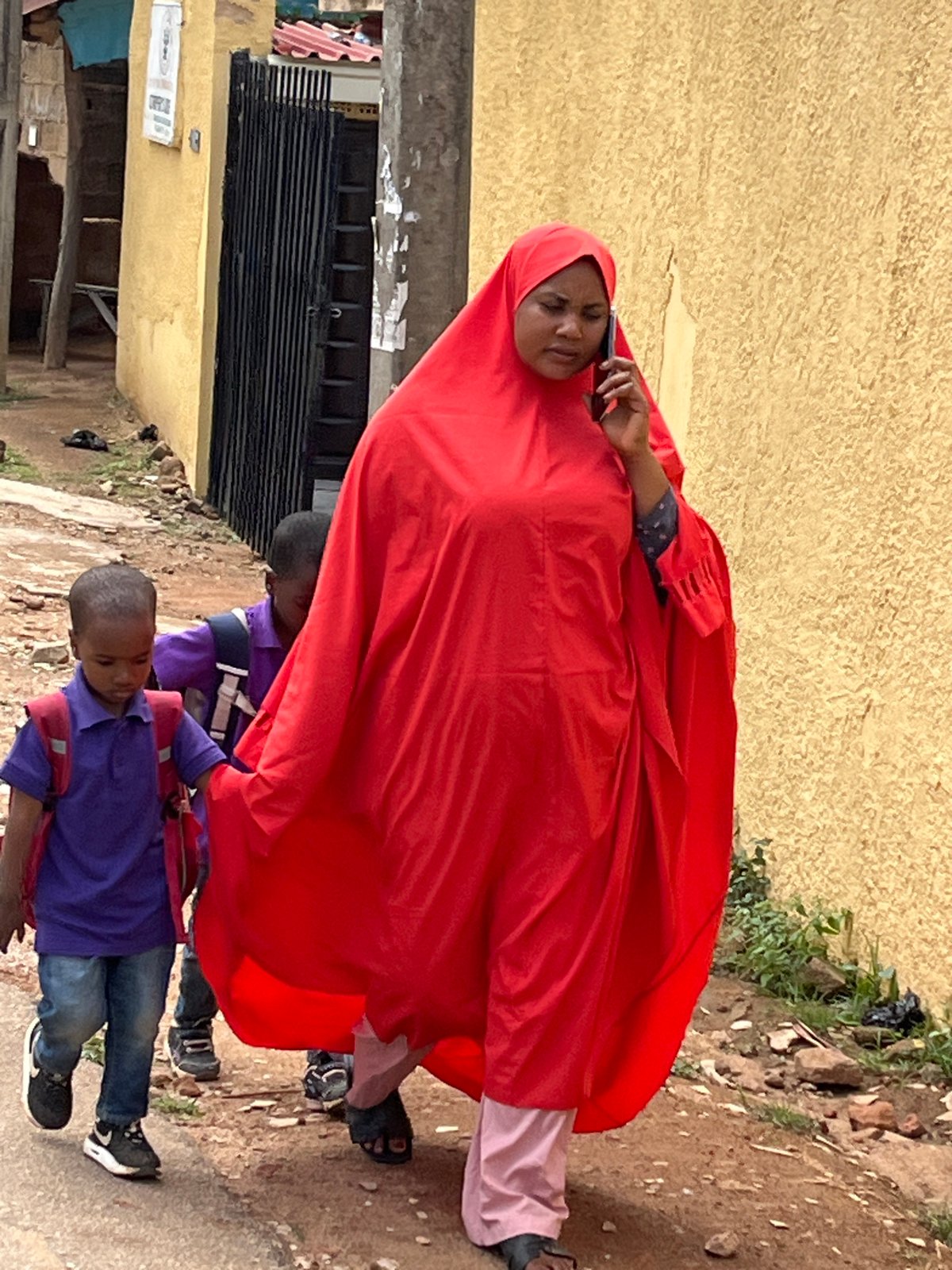 Daily life unfolds across Jos, Nigeria streets during midday