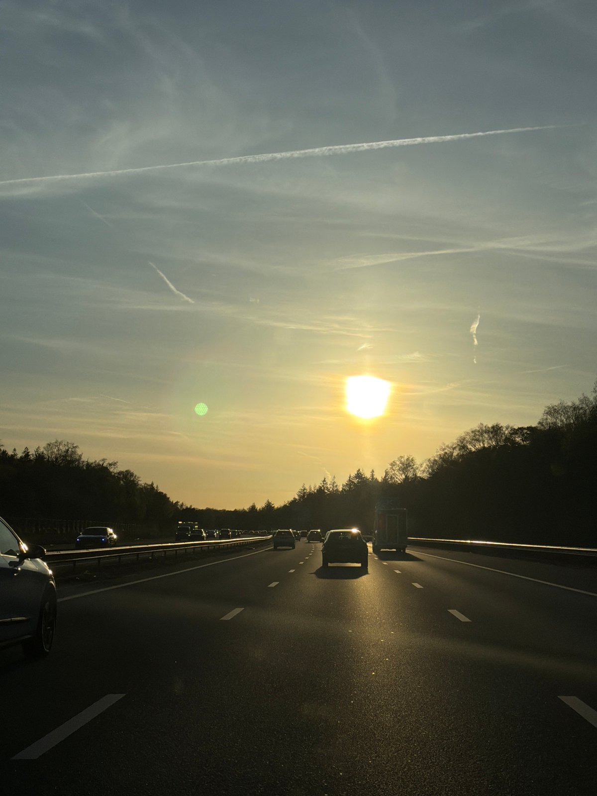 Evening traffic flows on Arnhem highway during sunset